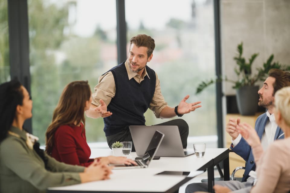 Operations team in a planning session in a bright meeting room