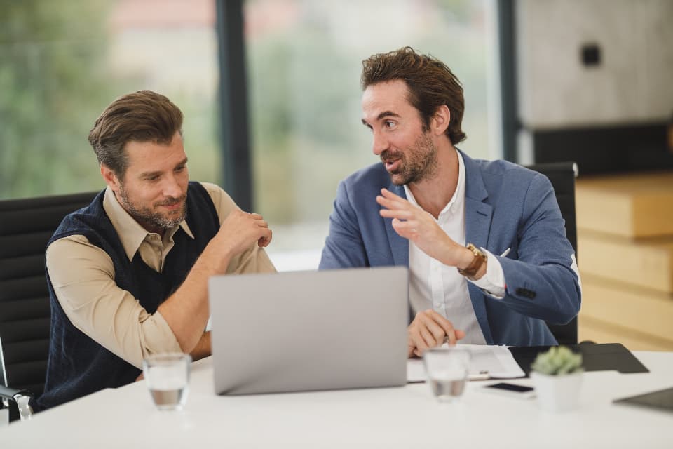 Customer experience leaders reviewing service results and retention priorities