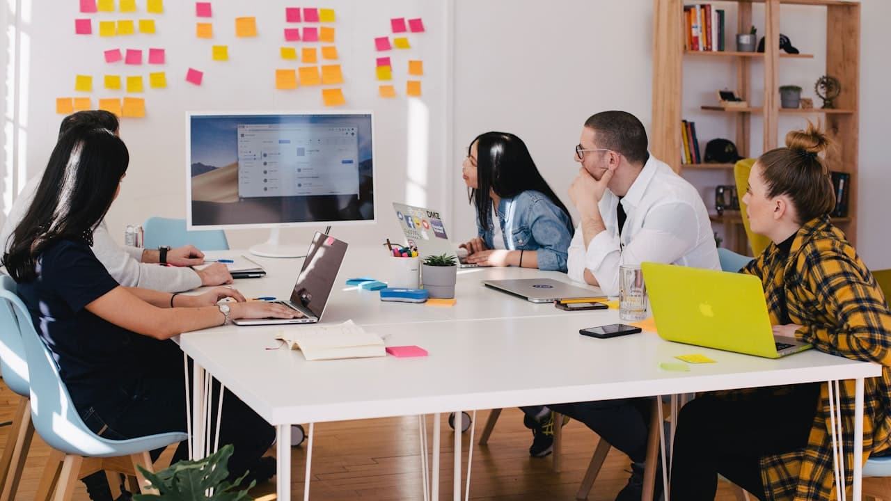Global Empire team working through a client decision